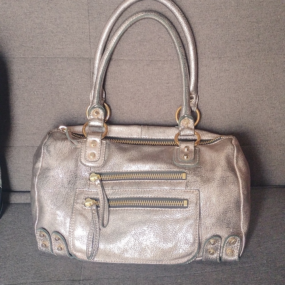 RareLinea Pelle Collection metallic Rose gold tote bag with gold tone hardware.